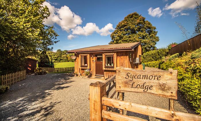 Sycamore Lodge entrance with parking up to 3 cars.